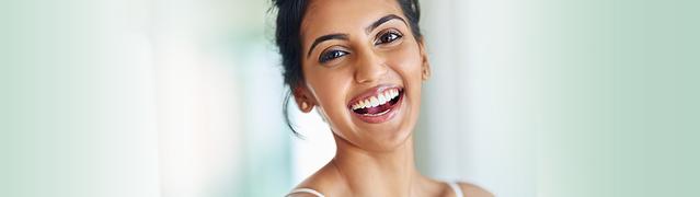 woman widely smiling after using Listerine
