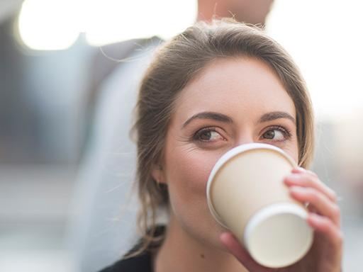 Listerine's on the go causes of bad breath - woman drinking coffee